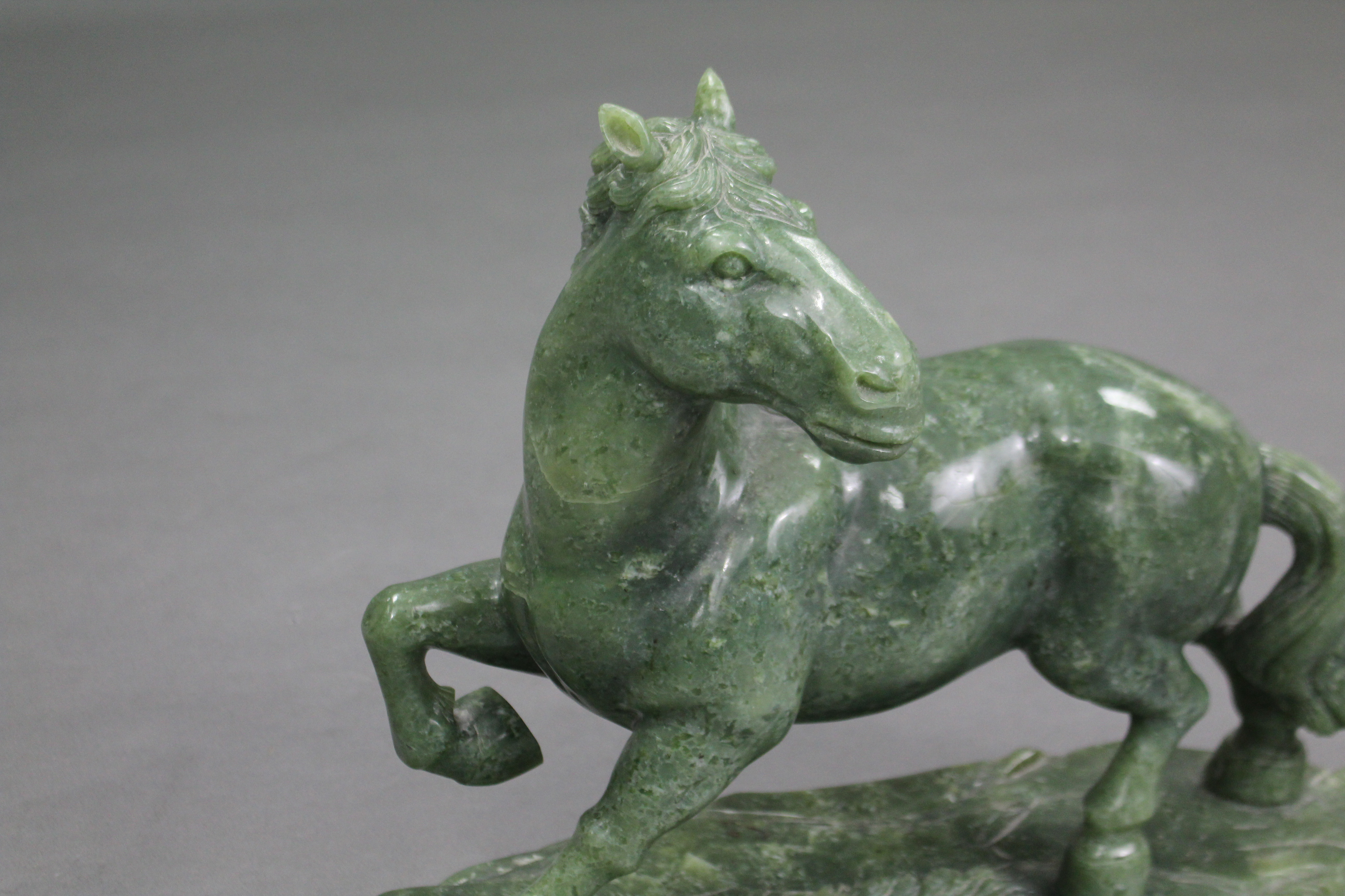 A LARGE CARVED GREEN JADE-ITE MODEL OF A HORSE, its right leg raised & head turned to the left, with - Image 4 of 4