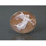 A carved shell oval cameo brooch depicting Aurora, 1?” x 1?”; in later 9ct. gold mount.