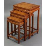 A nest of three Chinese teak occasional tables with shaped friezes & on square legs; 19” wide x
