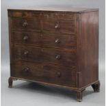An early 19th century mahogany large chest, fitted three shallow frieze drawers above two short &