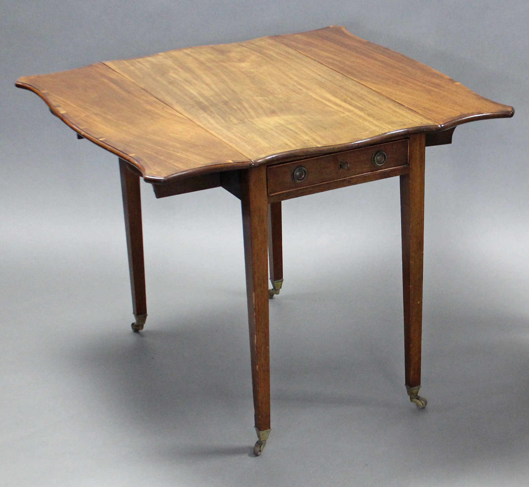 A George III mahogany Pembroke table of serpentine outline, the crossbanded top with canted corners, - Image 4 of 4