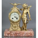 A 19th century French figural mantel clock, the 3” enamel dial with floral decoration & arabic