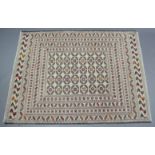 A Sumak needlework kelim rug of ivory ground with red, yellow & green geometric design to centre