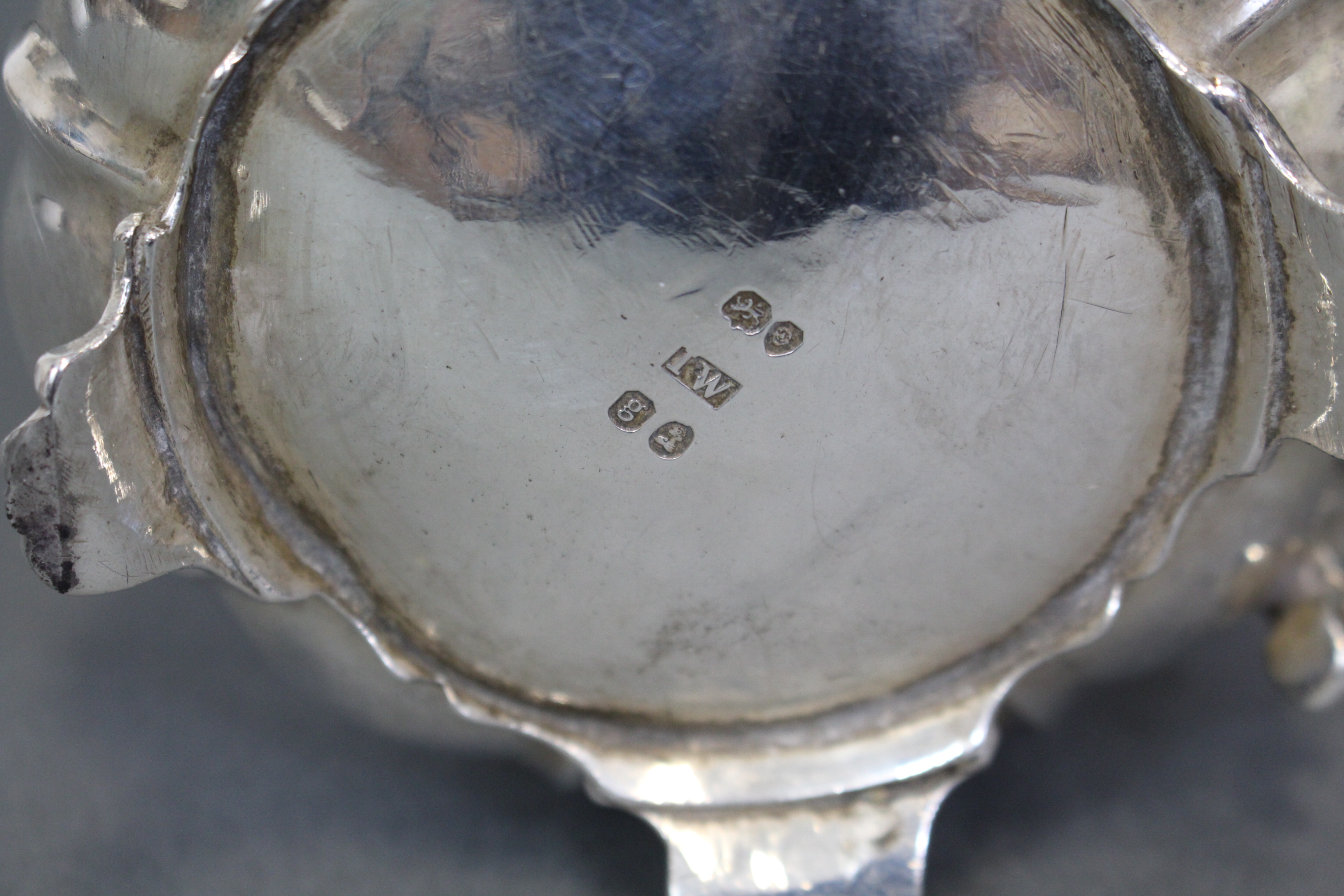 A George IV silver melon-shaped milk jug with moulded scroll handle & on four shell-scroll feet; - Image 3 of 3