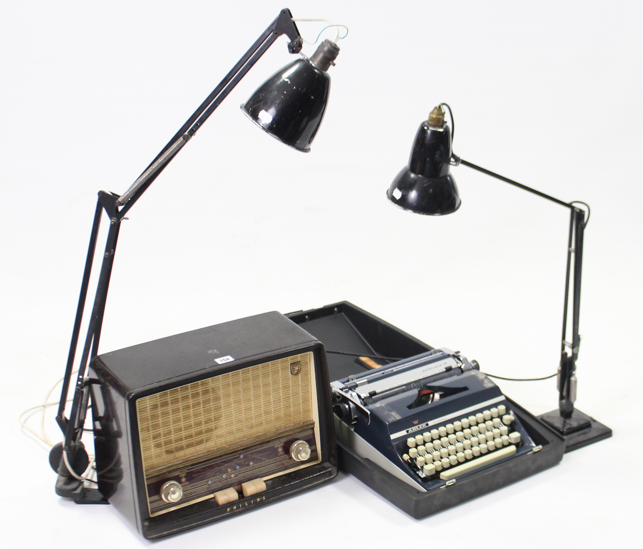 A Philips valve radio in brown Bakelite case; together with two anglepoise-type lamps; & an Adler