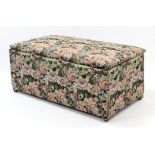 An early/mid-20th century deal ottoman upholstered floral material, & with hinged lift-lid, 49”