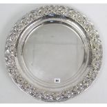 A large silver plated circular tray with embossed grapevine border, 20½” diam.