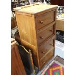 A pine small upright chest, fitted four long drawers with turned knob handles, & on shaped plinth