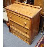 A ditto pine small chest, fitted three long drawers, 27¾” wide x 36” high.