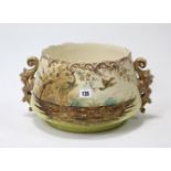 A pottery circular two-handled jardinière with painted wading bird & foliate design, 10” diam x