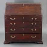 A late 18th century mahogany bureau, the fitted interior enclosed by sloping fall-front above four