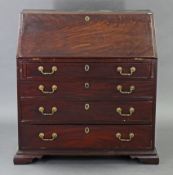 A late 18th century mahogany bureau, the fitted interior enclosed by sloping fall-front above four