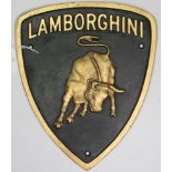 A reproduction painted cast-iron shield-shape sign “LAMBORGHINI”, 11½” x 9½”.