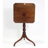A 19th century mahogany tripod table with canted corners to the rectangular top, & on vase-turned
