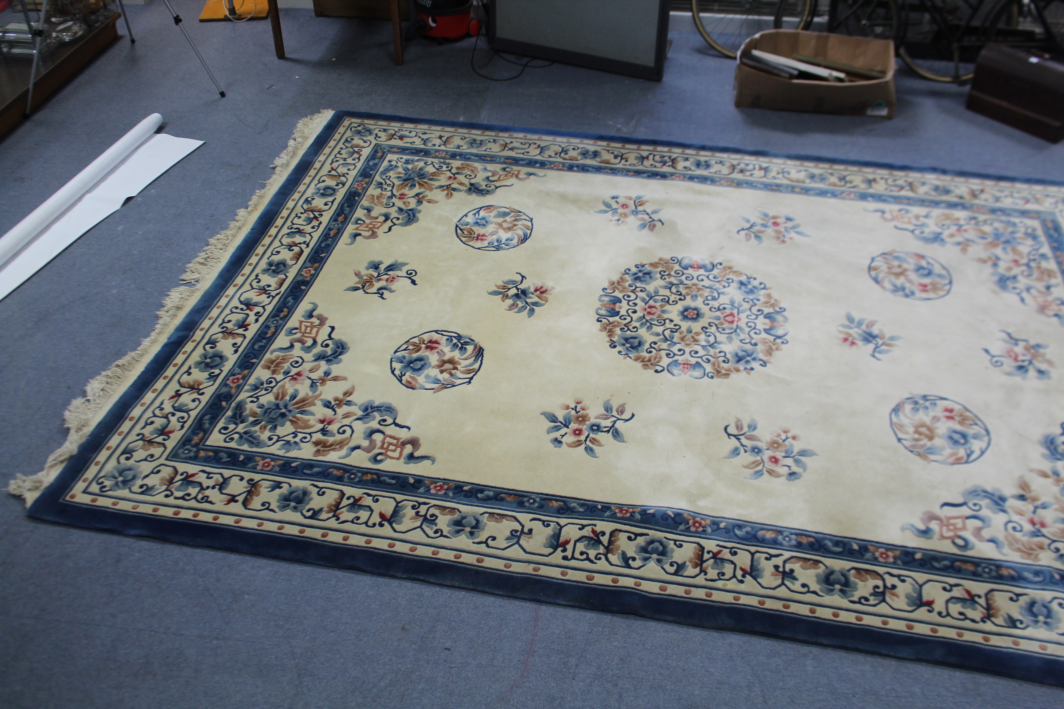 A Chinese-style carpet of cream ground & with bright-coloured floral design to centre within a - Image 2 of 5