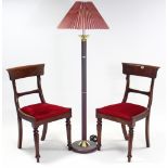 A pair of Victorian mahogany bow-back dining chairs with padded drop-in seats, & on turned tapered