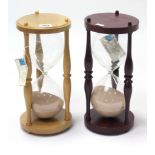 A Bryan J Webb Lemonwood hourglass; & a ditto purpleheart hourglass, both 12½” high.