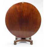 A 19th century mahogany pedestal dining table with circular tilt-top, & on square tapered centre