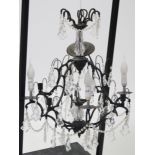 A modern ceiling light fitting; a black-finish table lamp; & various decorative pictures & picture