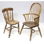 A Windsor-style elbow chair with spindles to the hooped back, with hard seat, & on turned legs