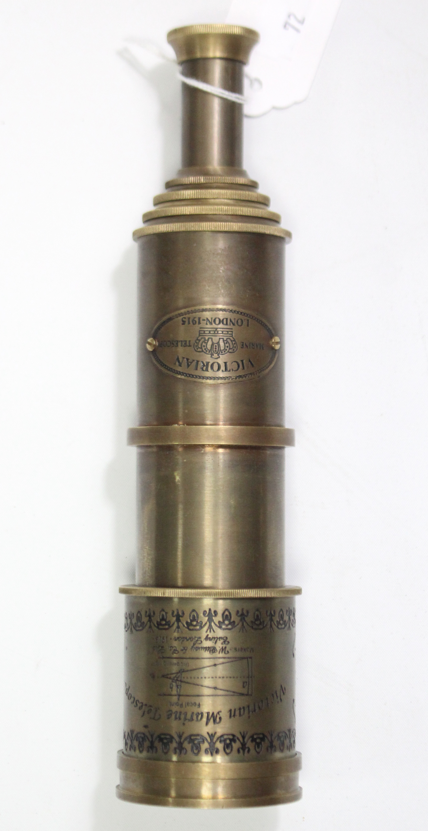 A reproduction brass six-drawer marine telescope, 19½” long.