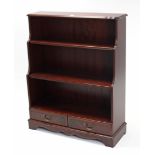 A reproduction mahogany three-tier “waterfall” bookcase, 35½” wide x 44½” high.