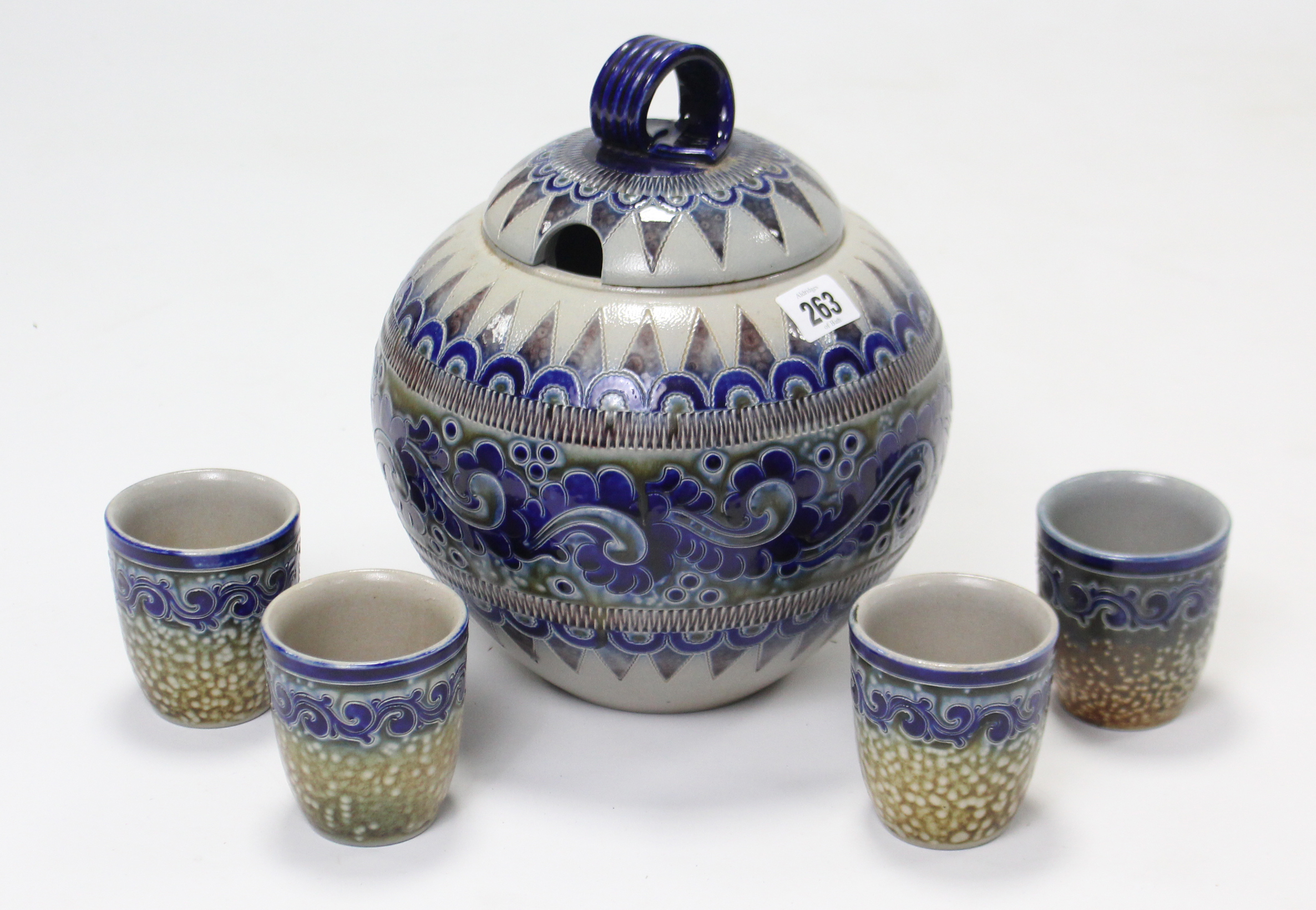 A German stoneware Rumtopf with stylised geometric design, 10½” high & a ditto set of four cups.