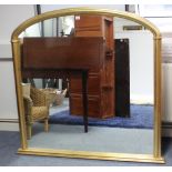 A 19th century-style gilt frame overmantel mirror with rounded top & with fluted border, 47” x 49”.
