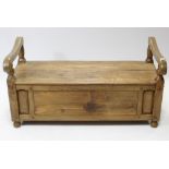 A hardwood hall bench with hard seat above a long drawer, with panelled sides, & on turned feet, 54”