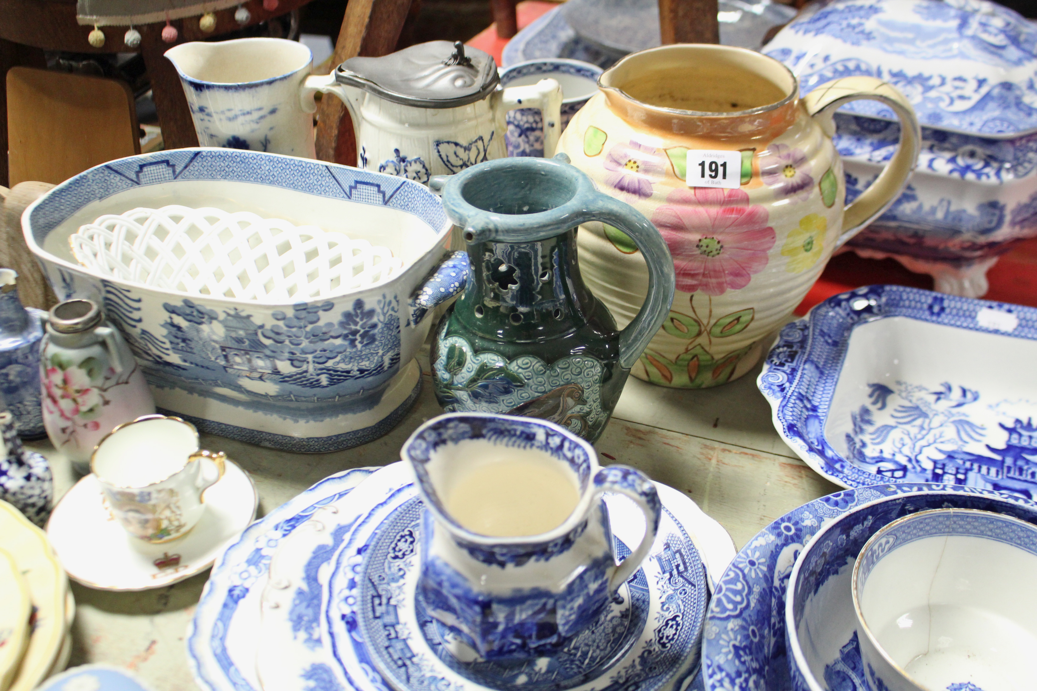 A Kensington ware floral decorated large jug, 7¾” high; a pair of cauldron blue & white decorated