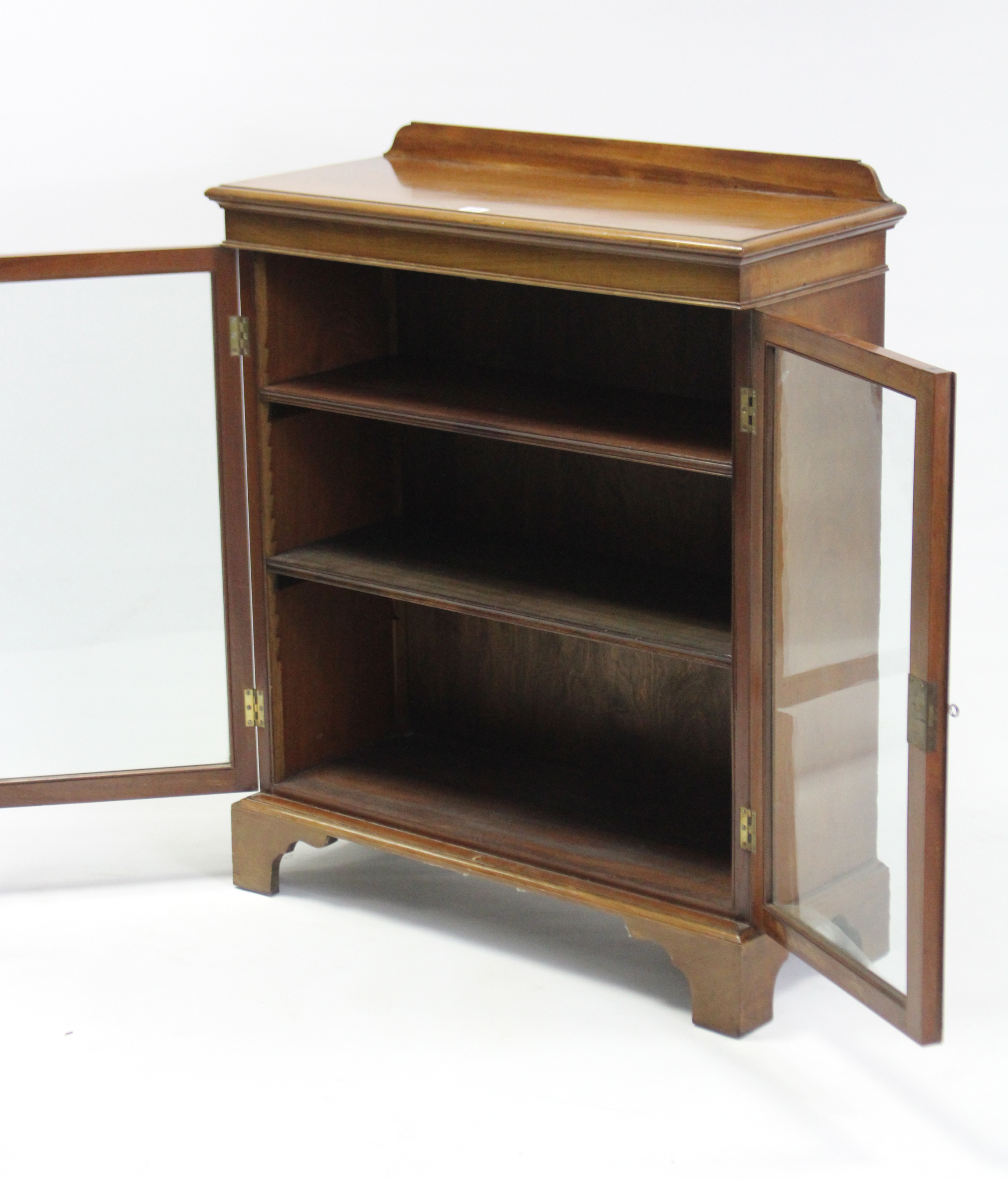 A mahogany dwarf cabinet, with two adjustable shelves enclosed by pair of glazed doors, & on bracket - Image 2 of 2