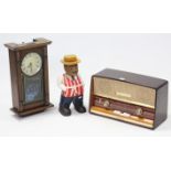 A Stella valve radio in walnut-finish case; together with a 31-day wall clock; a painted & carved