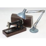 A Singer hand sewing machine with oak case; & an anglepoise-type desk lamp.