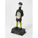 A reproduction painted cast-iron “Guinness” advertising figure, 14¼” high.