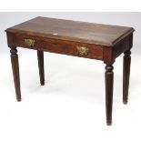 A late Victorian oak side table with moulded edge to the rectangular top, fitted frieze drawer, & on
