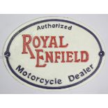 A reproduction painted cast-iron oval sign “Authorised ROYAL ENFIELD Motorcycle Dealer”, 8” x 11”.