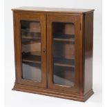An oak small standing bookcase, fitted two shelves enclosed by pair of glazed doors, 33½” wide x 36”