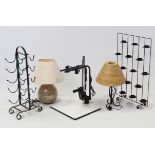 A wrought-metal ten-division wine rack; a similar tea light display; two table lamps; & a