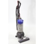 A Dyson “DC41” upright vacuum cleaner.