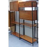 A Chinese teak Ladderax-type tall inter-changeable wall unit fitted with an arrangement of cupboards