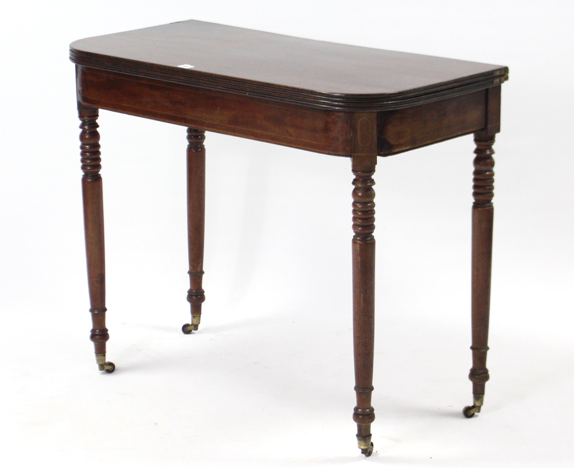 A 19th century mahogany tea table with moulded edge & rounded corners to the rectangular fold-over