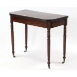 A 19th century mahogany tea table with moulded edge & rounded corners to the rectangular fold-over