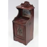 A late Victorian mahogany purdonium enclosed by carved panel door, 16¾” wide x 39” high.