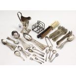 A silver plated helmet-shaped cream jug, 5½” high; a silver-plated four-division toast rack; &