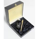 A Mont Blanc desk fountain pen in fitted case, & complete with a bottle of ink.
