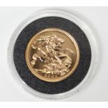 An Elizabeth II 2001 Gold Proof sovereign.