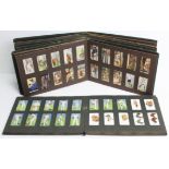 Five hundred various cigarette cards by W.D. & H.O. Wills, & John Player, contained in four