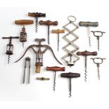 Thirteen various cork screws; & a pair of nut crackers.