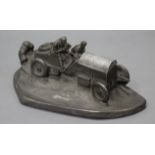 A large pewter-finish composition novelty desk, inkstand in the form of a vintage motor car,