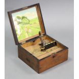 A late 19th/early 20th century inlaid-walnut music box with pictorial panel to the inside of the
